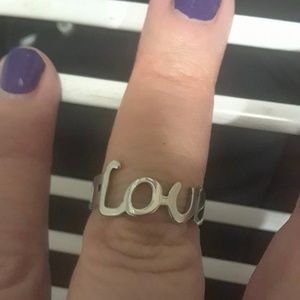 Stainless steel ring that spells Love